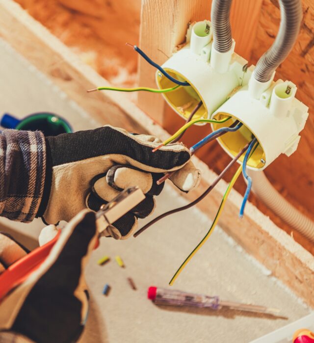 Electrician wiring a new home.